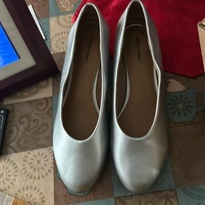 Never worn silver pumps.